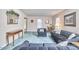 Cozy living room featuring comfortable blue furniture and elegant decor at 1913 Fawndale Dr, Raleigh, NC 27612