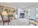 Cozy living room with brick fireplace, built-in shelves, and comfortable seating at 1913 Fawndale Dr, Raleigh, NC 27612
