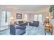 Cozy living room featuring plush furniture, soft lighting, and large windows offering natural light at 1913 Fawndale Dr, Raleigh, NC 27612
