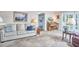 Comfortable living room with piano, large windows, and sofa at 1913 Fawndale Dr, Raleigh, NC 27612