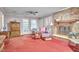 Inviting living room featuring a fireplace, neutral walls, and access to the outdoors at 1913 Fawndale Dr, Raleigh, NC 27612