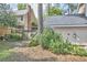 A charming backyard features a wooden fence, lush greenery, and a delightful garden area at 1913 Fawndale Dr, Raleigh, NC 27612