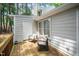 Relaxing back porch with two chairs, providing a serene outdoor space for enjoying the fresh air at 213 Bracken Ct, Raleigh, NC 27615