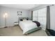 Comfortable bedroom with a neutral color scheme, plush carpeting, and a serene ambiance at 213 Bracken Ct, Raleigh, NC 27615