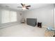 Bright and airy bedroom featuring a Murphy bed and chair, offering versatility and comfort at 213 Bracken Ct, Raleigh, NC 27615