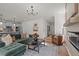 Cozy living room with a fireplace, hardwood floors, and an open concept to the kitchen at 215 Faith Avenue, Sanford, NC 27330
