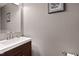 Modern half bath with elegant vanity, sleek sink, contemporary faucet, and neutral wall paint at 2302 Fordcrest Dr, Apex, NC 27502