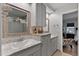 Bathroom with double sinks, granite countertops, and framed mirrors above matching gray vanities at 2302 Fordcrest Dr, Apex, NC 27502
