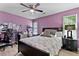 Charming bedroom with hardwood floors, natural light and dark wood furniture at 2302 Fordcrest Dr, Apex, NC 27502