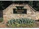 Stone community entrance sign that reads Waterford Green with beautiful flower bed at 2302 Fordcrest Dr, Apex, NC 27502