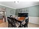Cozy dining room with a hardwood floors, modern decor, and ample seating for gatherings at 2302 Fordcrest Dr, Apex, NC 27502