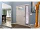 Bright entry way with tiled floors, natural light, and view into the dining area at 2302 Fordcrest Dr, Apex, NC 27502