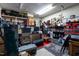 Organized garage with shelving, storage containers, tools, and various equipment for hobbies and projects at 2302 Fordcrest Dr, Apex, NC 27502
