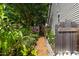 Backyard includes vegetable garden, raised garden beds and wood chip paths at 2302 Fordcrest Dr, Apex, NC 27502