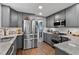 Updated kitchen with granite countertops, subway tile backsplash, and stainless steel appliances at 2302 Fordcrest Dr, Apex, NC 27502