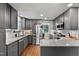Updated kitchen with granite countertops, gray cabinets, and stainless steel appliances at 2302 Fordcrest Dr, Apex, NC 27502