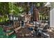 Backyard includes outdoor kitchen area with wood storage, grill area, and outdoor seating at 2302 Fordcrest Dr, Apex, NC 27502