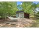 Backyard featuring a hammock, storage shed, and a tranquil setting for relaxation and outdoor enjoyment at 2322 Stroller Ave, Durham, NC 27705