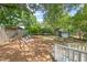 Backyard with mature trees and a shed at 2322 Stroller Ave, Durham, NC 27705