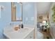 Bathroom showcasing a white vanity with modern fixtures and a glimpse of a bedroom at 2322 Stroller Ave, Durham, NC 27705