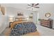 Bedroom showcasing a ceiling fan, neutral walls, and a decorative dresser at 2322 Stroller Ave, Durham, NC 27705