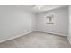 Neutral bedroom with plush carpeting and a window that provides natural light at 2322 Stroller Ave, Durham, NC 27705