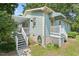Charming home with a covered porch, awnings, and well-maintained landscaping, offering curb appeal and outdoor comfort at 2322 Stroller Ave, Durham, NC 27705