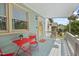 Cozy covered front porch with seating and a view of the yard at 2322 Stroller Ave, Durham, NC 27705
