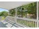 Covered front porch with hanging plants and a view of the neighborhood at 2322 Stroller Ave, Durham, NC 27705