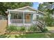 Charming home featuring a covered front porch and beautiful landscaping at 2322 Stroller Ave, Durham, NC 27705