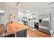 Bright kitchen featuring white cabinets and stainless steel appliances at 2322 Stroller Ave, Durham, NC 27705