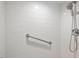 This shower features clean white tile and a convenient grab bar at 2322 Stroller Ave, Durham, NC 27705
