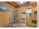 Unfinished storage space showcasing exposed beams, shelving, and natural light through a window at 2322 Stroller Ave, Durham, NC 27705