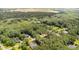 Panoramic aerial view of a residential area surrounded by lush greenery and trees at 240 Oak Grove Church Rd, Youngsville, NC 27596