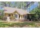Charming home with a screened-in porch surrounded by lush landscaping at 240 Oak Grove Church Rd, Youngsville, NC 27596