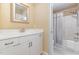 Bright bathroom with a white vanity, chrome fixtures, and a shower with a tub at 240 Oak Grove Church Rd, Youngsville, NC 27596