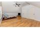 Bonus room with vaulted ceilings, hardwood floors, and a ceiling fan at 240 Oak Grove Church Rd, Youngsville, NC 27596
