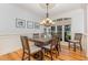 Elegant dining room with hardwood floors, decorative lighting, and stylish table set at 240 Oak Grove Church Rd, Youngsville, NC 27596