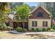Charming home with stone and siding exterior, manicured lawn, and inviting front porch at 240 Oak Grove Church Rd, Youngsville, NC 27596