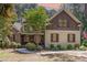 Charming home with stone and siding exterior, manicured lawn, and inviting front porch at 240 Oak Grove Church Rd, Youngsville, NC 27596