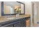 Granite counter tops and dark wood cabinets give the main bathroom a traditional feel at 240 Oak Grove Church Rd, Youngsville, NC 27596