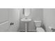 Clean half-bathroom with pedestal sink and modern fixtures at 2539 Kasota Ln, Raleigh, NC 27610