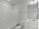 Bright bathroom featuring a shower-tub combo, white vanity with sink, and toilet at 2539 Kasota Ln, Raleigh, NC 27610