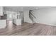 Open-concept living area boasts hardwood floors, neutral tones, and a modern kitchen island at 2539 Kasota Ln, Raleigh, NC 27610