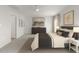 This is a spacious main bedroom with neutral colors, carpet floors, and ample natural light at 2539 Kasota Ln, Raleigh, NC 27610