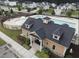 An aerial view of the clubhouse exterior next to the community pool and playground at 2613 Red Spruce Dr, Raleigh, NC 27616