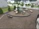 The fenced community playground offers a slide, climbing equipment, and benches for relaxation at 2613 Red Spruce Dr, Raleigh, NC 27616