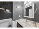 Charming half-bathroom featuring modern fixtures and stylish gray walls at 2904 Britmass Dr, Raleigh, NC 27616