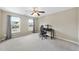 Bonus room with plush carpet and windows that let in plenty of natural light, plus a ceiling fan at 2904 Britmass Dr, Raleigh, NC 27616
