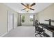 Second bonus room with plush carpet, neutral paint, a ceiling fan and large windows providing natural light at 2904 Britmass Dr, Raleigh, NC 27616